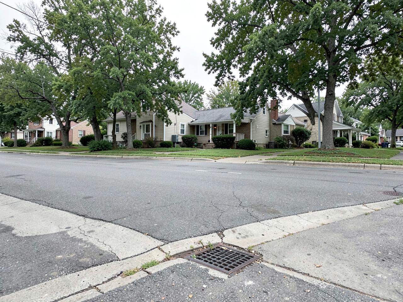 Residential street in Union County, New Jersey with a curbside storm drain